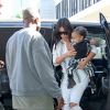 Kim Kardashian, Kanye West et leur fille North arrivent à l'aéroport de Los Angeles. Le 1er septembre 2014.
