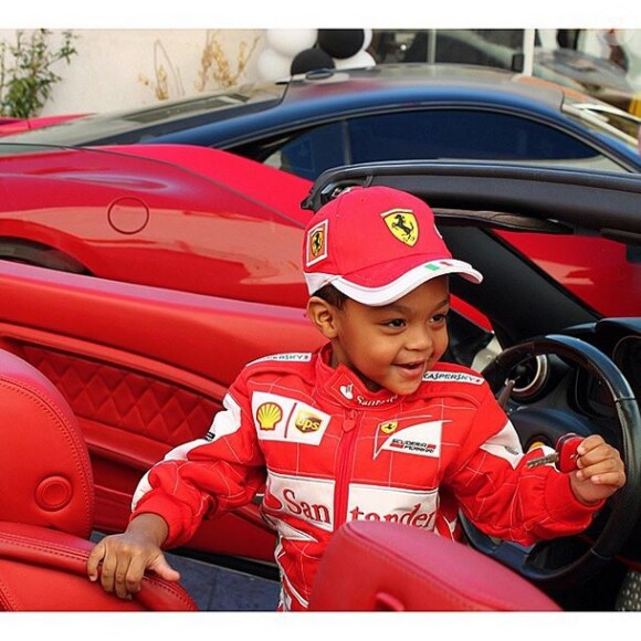 Sire, le fils cadet de 50 Cent, comblé dans la Ferrari de son père. Septembre 2014.