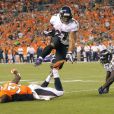  Ray Rice va au touchdown pour les Baltimore Ravens lors d'un match contre les Denver Broncos en septembre 2013 