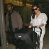 Kanye West, Kim Kardashian et leur fille North arrivent à l'aéroport de Los Angeles, en provenance de Brisbane. Le 16 septembre 2014.