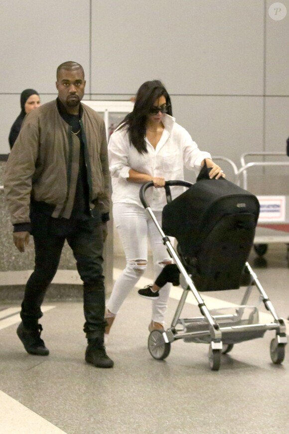 Kanye West, Kim Kardashian et leur fille North, de retour à Los Angeles après leur séjour en Australie. Le 16 septembre 2014.