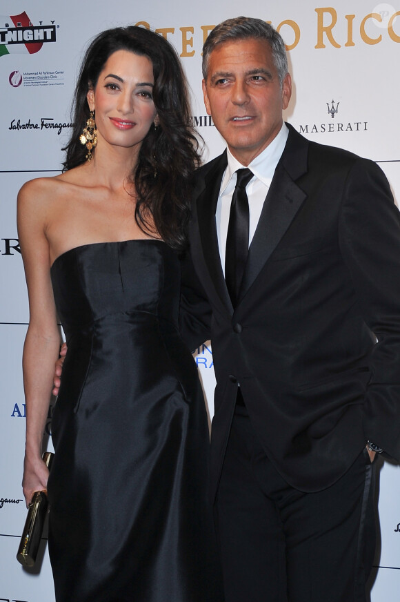 George Clooney et sa fiancée Amal Alamuddin assistent à la soirée "Celebrity Fight Night" à Forte dei Marmi, Florence, le 7 septembre 2014.