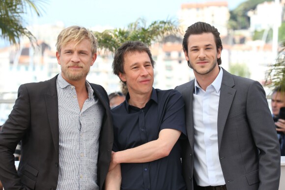 Jérémie Renier, Bertrand Bonello, Gaspard Ulliel - Photocall du film "Saint Laurent" lors du 67e festival international du film de Cannes, le 17 mai 2014.