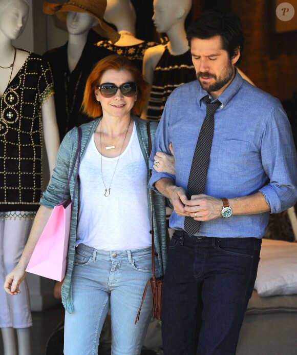 Exclusif - Alyson Hannigan et son mari Alexis Denisof font du shopping à Brentwood, le 11 juillet 2014.