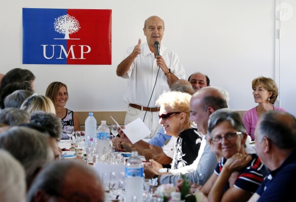 Alain Juppé et sa femme Isabelle lors d'un déjeuner-débat à Castillon-de-Castets le 27 septembre 2014.