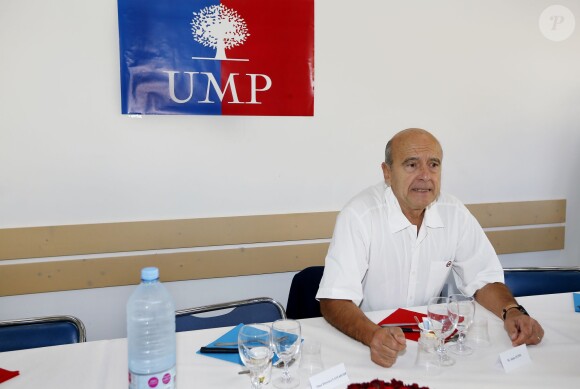 Alain Juppé et sa femme Isabelle lors d'un déjeuner-débat à Castillon-de-Castets le 27 septembre 2014.