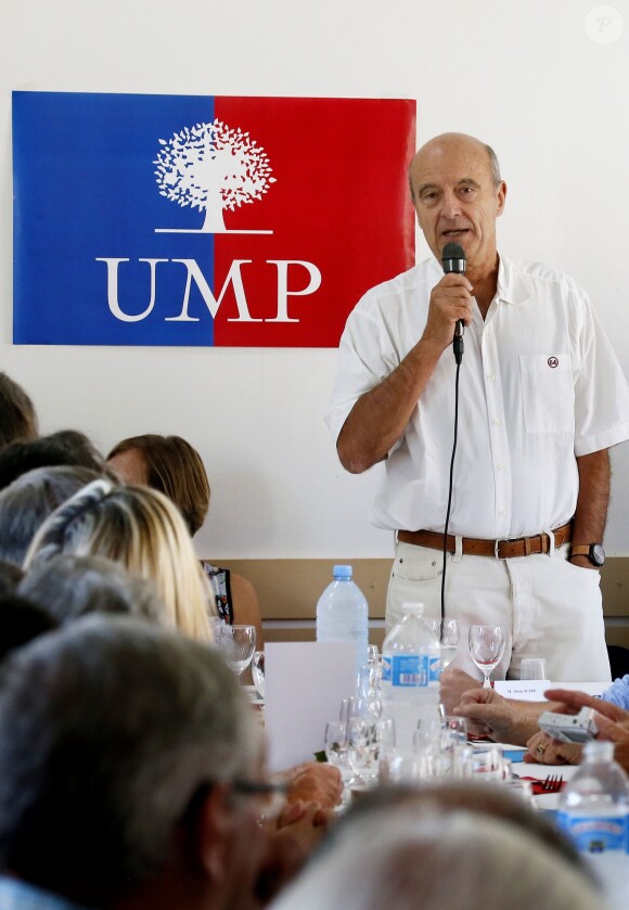 Alain Juppé et sa femme Isabelle lors d'un déjeuner-débat à Castillon-de-Castets le 27 septembre 2014.