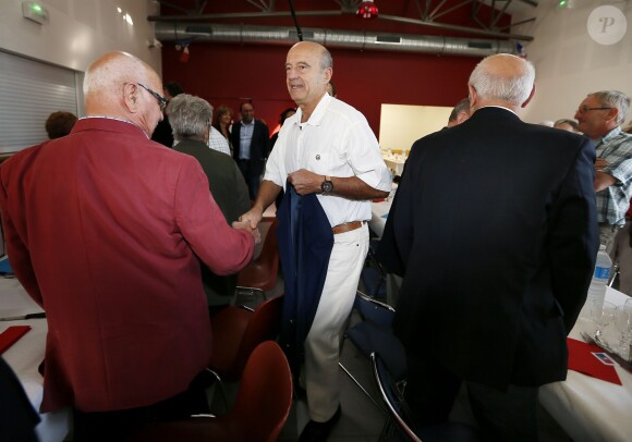 Alain Juppé et sa femme Isabelle lors d'un déjeuner-débat à Castillon-de-Castets le 27 septembre 2014.