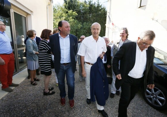 Alain Juppé et sa femme Isabelle lors d'un déjeuner-débat à Castillon-de-Castets le 27 septembre 2014.