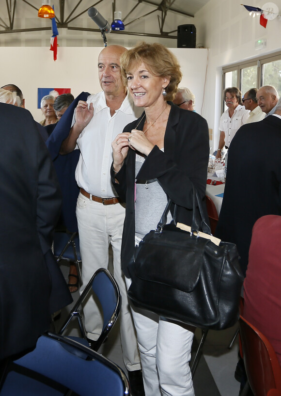 Exclusive- Mayor of the city Alain Juppe and his wife Isabelle participe at UMP Meeting in Castillon, western France, on September 27, 2014. Photo by Patrick Bernard/ABACAPRESS.COM28/09/2014 - Castillon