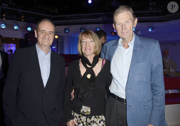 Etienne Mougeotte et sa femme avec Pierre Lescure - Michel Drucker a remis la Légion d'honneur à Jean Nainchrik au Pavillon Gabriel à Paris, le 28 septembre 2014.