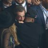 Jay Z embrasse Nicolas Sarkozy sous le regard de Beyoncé et Nagui - Match PSG-Barcelone de la Ligue des Champions au parc des princes à Paris le 30 septembre 2014. Le PSG à remporté le match sur le score de 3-2.