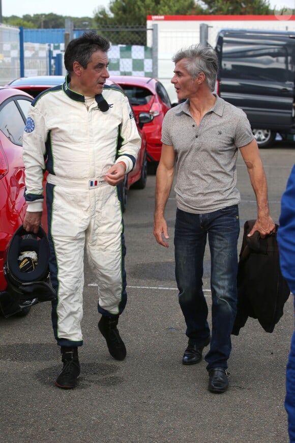 Exclusif - Cyril Viguier rencontre François Fillon au Mans, le 4 juillet 2014, sur le circuit des 24 Heures du Mans à l'occasion du Mans Classic.