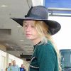 La rappeuse Iggy Azalea va prendre un avion à l'aéroport de Los Angeles, le 9 octobre 2014. 