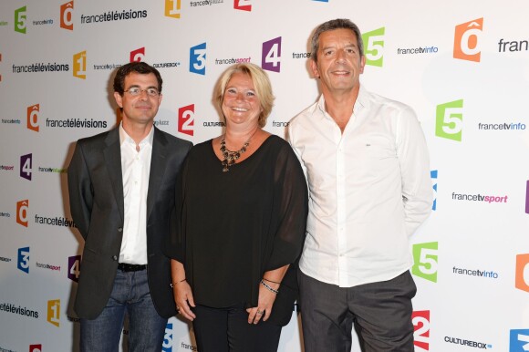 Michel Cymes, Marina Carrère d'Encausse et Benoît Thévenet à Paris, le 26 août 2014.