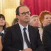 François Hollande et Michel Sapin à l'Elysée lors du match entre la France et le Nigeria en huitième de finale de la Coupe du monde, à Paris le 30 jun 2014