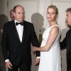 La princesse Charlene de Monaco était éblouissante en robe de mousseline blanche Dior haute couture, au bras du prince Albert, le 8 octobre 2014 à Los Angeles pour les 30e Princess Grace Awards. Presque simultanément, le palais princier révélait qu'elle était enceinte de jumeaux.