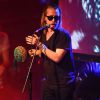 Macaulay Culkin en concert avec son groupe Pizza Underground à Nottingham en Angleterre, le 25 mai 2014.