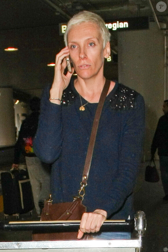 Toni Collette méconnaissable à son arrivée au LAX, Los Angeles, le 3 décembre 2014.