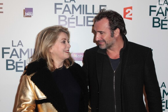Catherine Deneuve et Jean Dujardin lors de l'avant première du film La Famille Bélier au cinéma le Grand Rex à Paris le 9 décembre 2014.