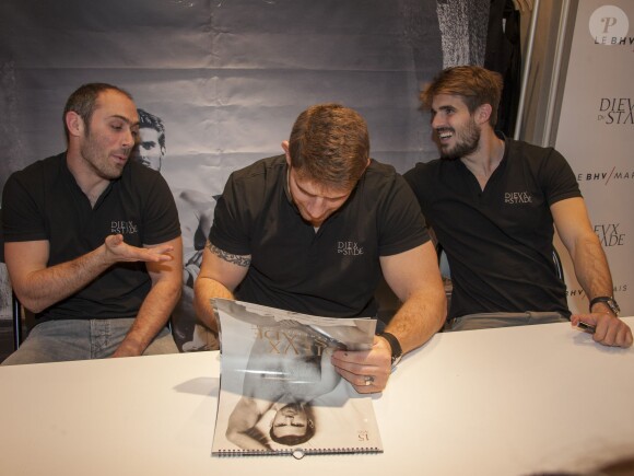 Julien Dupuy, Pascal Papé, Hugo Bonneval lors d'une séance de dédicace du calendrier Les Dieux du Stade au BHV Marais L'Homme à Paris, le 14 décembre 2014