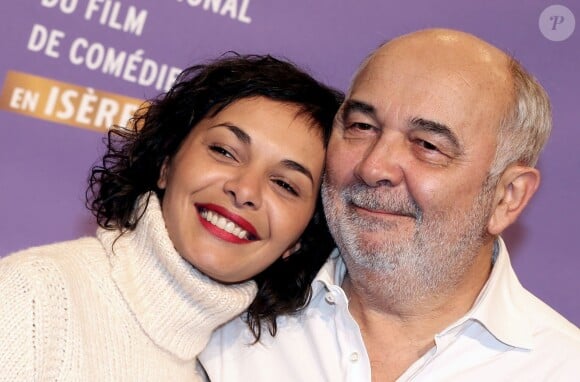 Gérard Jugnot et sa compagne Saida Jawad lors du 17e Festival international du film de comédie de l'Alpe d'Huez, le 17 janvier 2014.