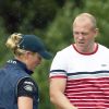 Zara Phillips et son mari Mike Tindall avec leur fille Mia, 6 mois, en poussette le 2 août 2014 à Gatcombe Park lors du Festival du concours complet britannique.