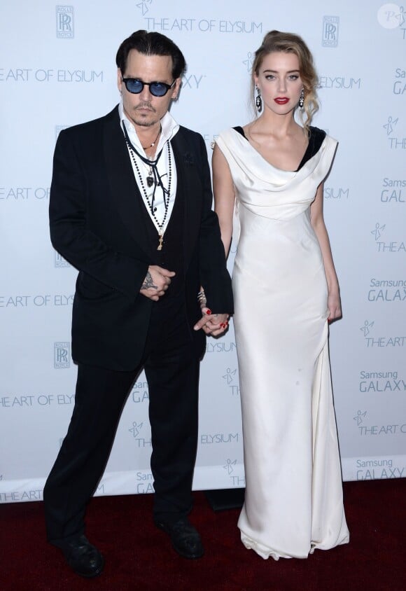Johnny Depp et Amber Heard lors de la soirée The Art Of Elysium presents Marina Abramovic's HEAVEN au Hangar 8 à Los Angeles, le 10 janvier 2015.