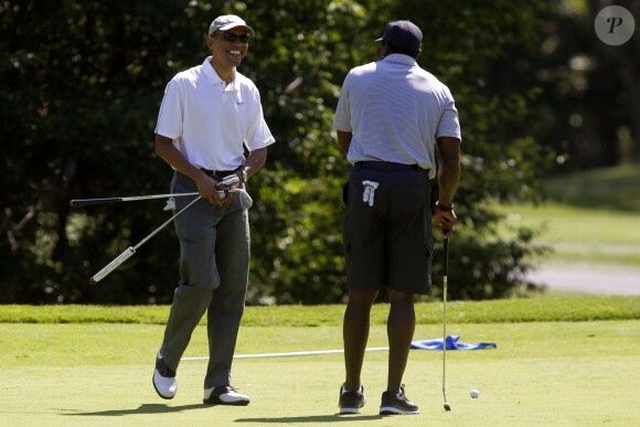 Barack Obama jouant au golf en août 2014
