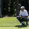 Barack Obama jouant au golf en août 2014