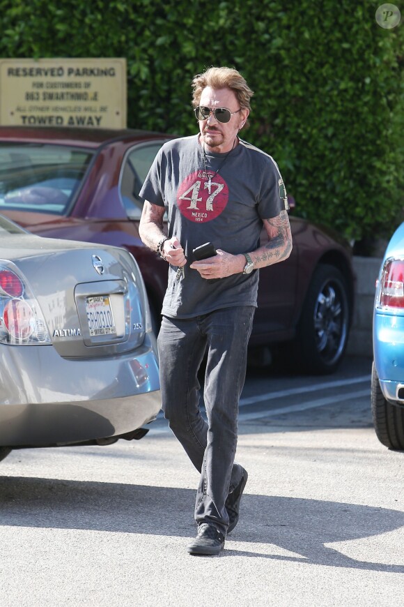 Exclusif - Le chanteur Johnny Hallyday emmène sa fille Jade déjeuner en Rolls-Royce décapotable bleue dans un restaurant à Pacific Palisades, le 31 janvier 2015.