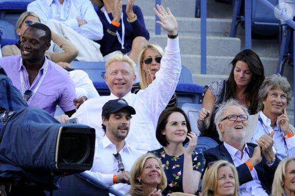 Michelle Dockery et son chéri John Dineen dans les gradins de l'US Open à New York en septembre 2013. Selon les médias britanniques, en février 2015, la star de Downton Abbey et son amoureux se sont fiancés.