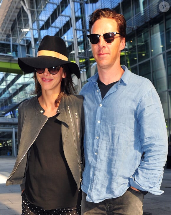 Benedict Cumberbatch and new wife Sophie Hunter showing off her baby bump, as they return to Heathrow airport in London, UK on March 7, 2015, from a honeymoon in Los Angeles. Photo by XPosure/ABACAPRESS.COM07/03/2015 - London