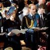 Le prince Harry, Kate Middleton, enceinte, et le prince William le 13 mars 2015 en la cathédrale St Paul de Londres, lors du service commémorant les 453 membres des forces armées britanniques morts lors des opérations en Afghanistan depuis 2001.