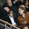 Michaël Youn, Sean Obispo et Pierre Sarkozy assistent au match de Ligue 1 opposant le PSG à Lorient, au Parc des Princes à Paris, le 20 mars 2015.