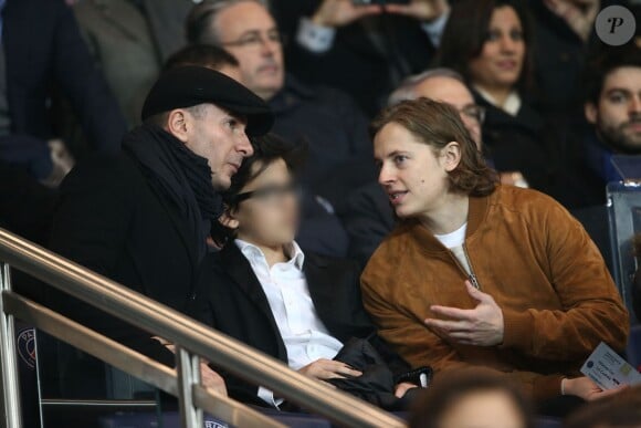 Michaël Youn, Sean Obispo et Pierre Sarkozy assistent au match de Ligue 1 opposant le PSG à Lorient, au Parc des Princes à Paris, le 20 mars 2015.