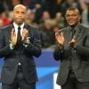 Thierry Henry et Marcel Dessailly lors de l'hommage rendus aux Bleus "centenaires", avant la rencontre France-Brésil au Stade de France à Saint-Denis, ke 26 mars 2015