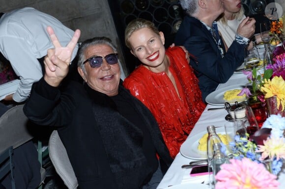 Roberto Cavalli et Karolina Kurkova lors du dîner de la soirée "Vogue 50 Archive" lors de la fashion week de Milan, le 21 septembre 2014.