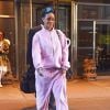 Rihanna à New York, porte une veste et un jogging en velours Sean John, un sac Christian Dior et des chaussures Degen. Le 13 mars 2015.