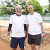 Raymond Domenech et Bernard de La Villardière lors du premier jour du 23e Trophée des personnalités Roland Garros, à Paris, le mardi 2 juin 2015.
