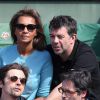 Les animateurs Karine Le Marchand et Stéphane Plaza - People dans les tribunes des Internationaux de France de tennis de Roland Garros à Paris. Le 1er juin 2015.