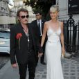 Johnny Hallyday et sa femme Laeticia Hallyday arrivent à la soirée "Vogue Paris Foundation Gala" au palais Galliera à Paris, le 6 juillet 2015.