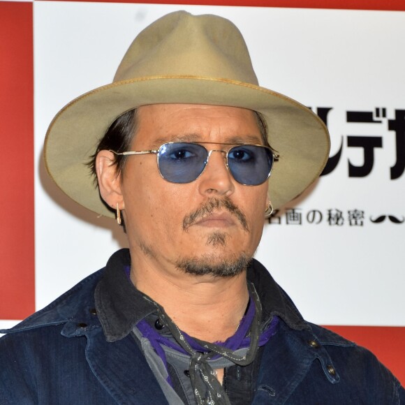 Johnny Depp pose lors du photocall du film "Charlie Mortdecai" à Tokyo, le 28 janvier 2015.