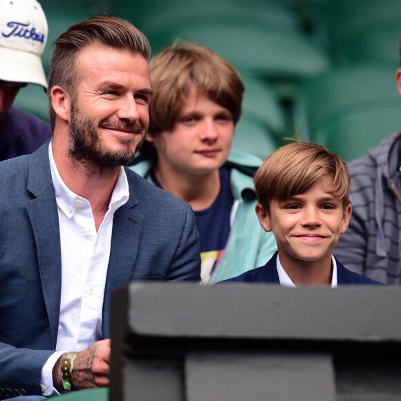 David Beckham et son fils Romeo au match d'Andy Murray au tournoi de Wimbledon à Londres, le 8 juillet 2015.