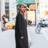 Taylor Swift quitte son appartement à New York, pour se rendre à la soirée des Billboard Women in Music Luncheon. Le 12 décembre 2014 