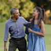 Le président Barack Obama et sa fille aînée Malia (17 ans) rentrent à la Maison Blanche après des vacances à Martha's Vineyard. Washington, le 23 août 2015.
