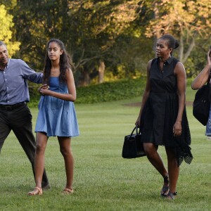 Le président Barack Obama, Michelle Obama et leurs filles Sasha et Malia rentrent à la Maison Blanche après des vacances à Martha's Vineyard. Washington, le 23 août 2015.