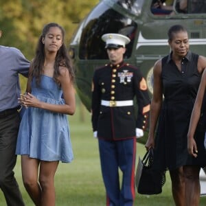 Le président Barack Obama, Michelle Obama et leurs filles Sasha et Malia rentrent à la Maison Blanche après des vacances à Martha's Vineyard. Washington, le 23 août 2015.