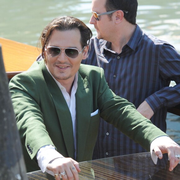 Johnny Depp, Scott Cooper et Dakota Johnson au 72e festival international du film de Venise , la Mostra, le 4 septembre 2015.