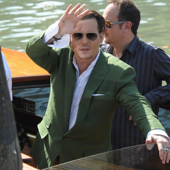 Johnny Depp, Scott Cooper et Dakota Johnson au 72e festival international du film de Venise , la Mostra, le 4 septembre 2015